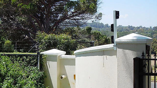 Outdoor detection beams mounted on boundary wall pillars